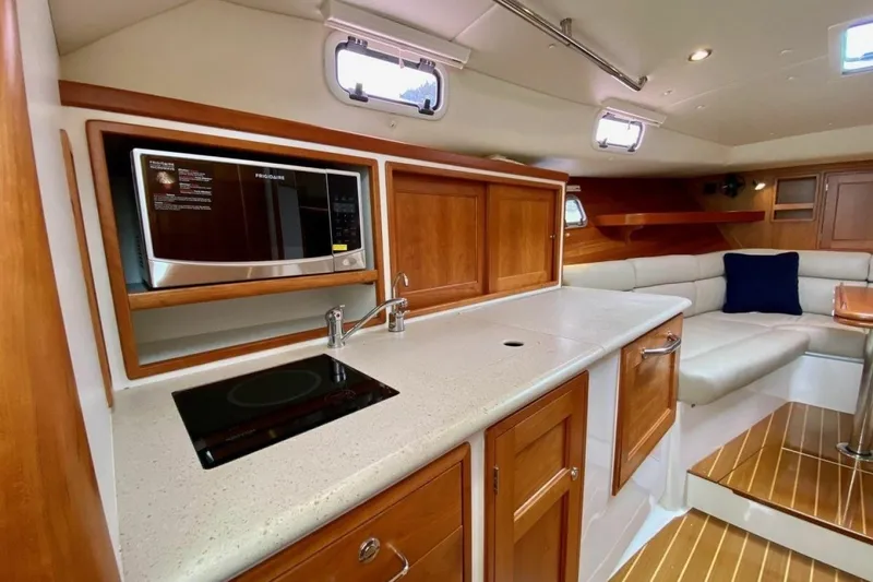 Slide: The Image of Interior of 2013 MJM 36z Downeast yacht with modern kitchen and seating area. - 20