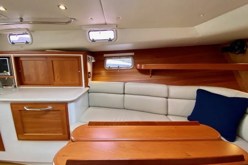 Slide: The Image of Interior of 2013 MJM 36z Downeast yacht with wooden cabinetry and cushioned seating. - 30