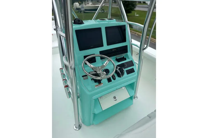 Slide: The Image of Center console of 2027 Pathfinder 2700 Tournament boat with dual screens and steering wheel. - 9