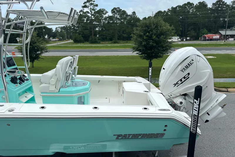 Slide: The Image of 2027 Pathfinder 2700 Tournament boat with Yamaha XTO outboard motor, parked outdoors. - 20