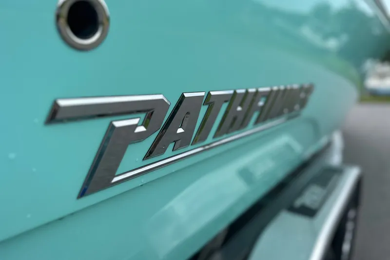 Slide: The Image of Close-up of 2027 Pathfinder 2700 Tournament logo on a teal boat. - 24