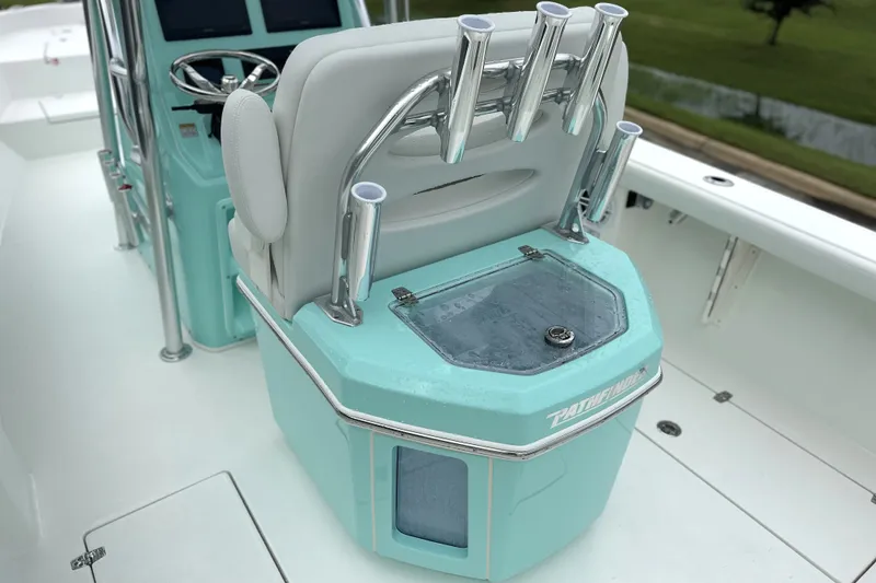 Slide: The Image of 2027 Pathfinder 2700 Tournament boat interior with rod holders and teal console. - 10