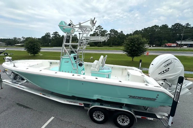 Slide: The Image of 2027 Pathfinder 2700 Tournament boat on trailer, featuring Yamaha outboard motor. - 18