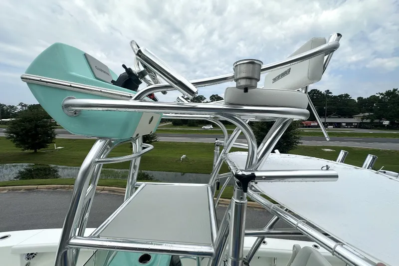Slide: The Image of Elevated helm station on 2027 Pathfinder 2700 Tournament boat, featuring sleek metal framework. - 15