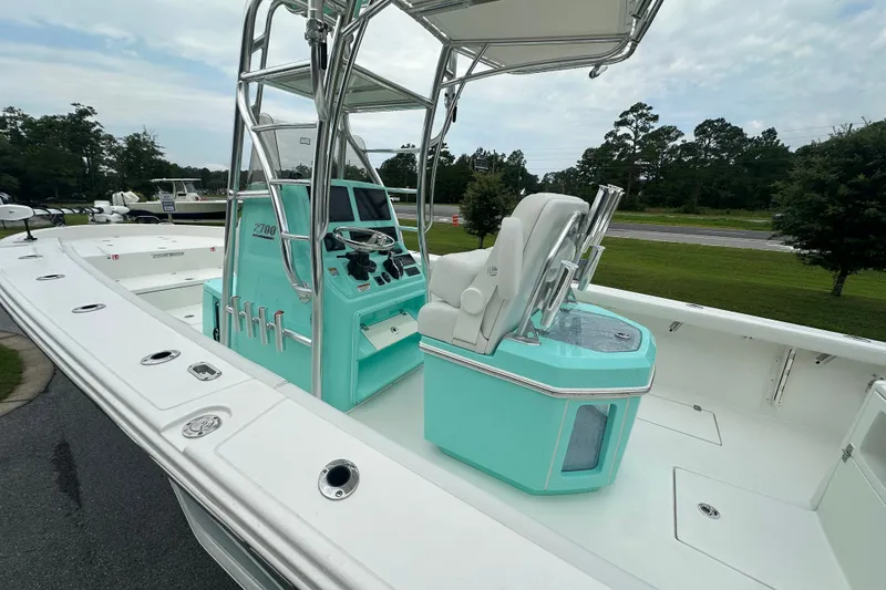 Slide: The Image of 2027 Pathfinder 2700 Tournament boat with sleek design and modern controls, docked outdoors. - 16