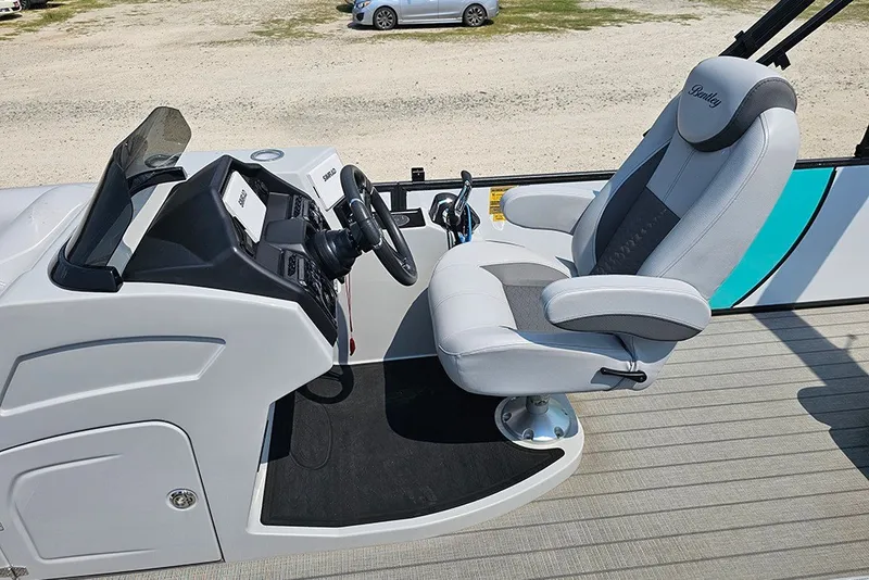 Slide: The Image of Captain's seat and helm of 2026 Bentley Pontoons 253 Elite Swingback DC. - 17