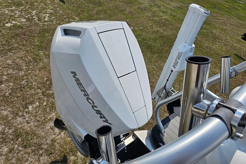 Slide: The Image of 2026 Bentley Pontoons 253 Elite Swingback DC with Mercury outboard engine, viewed from above. - 13