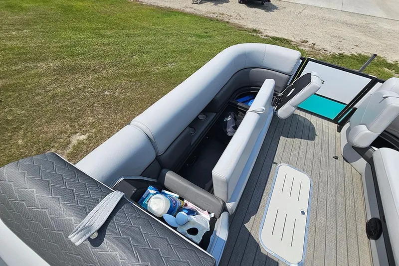 Slide: The Image of 2026 Bentley Pontoons 253 Elite Swingback DC interior with seating and storage compartments. - 22