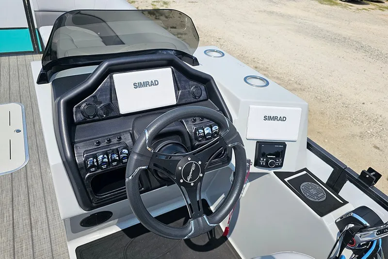 Slide: The Image of 2026 Bentley Pontoons 253 Elite Swingback DC helm with Simrad electronics and modern controls. - 18