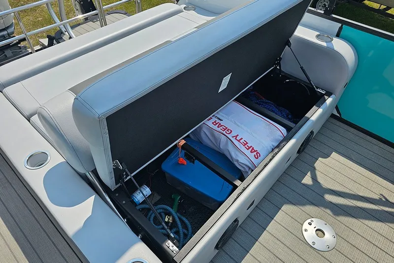 Slide: The Image of Storage compartment of 2026 Bentley Pontoons 253 Elite Swingback DC with safety gear and equipment. - 14