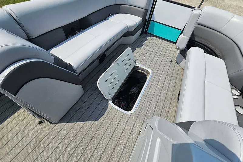 Slide: The Image of Interior of 2026 Bentley Pontoons 253 Elite Swingback DC with open storage compartment. - 23