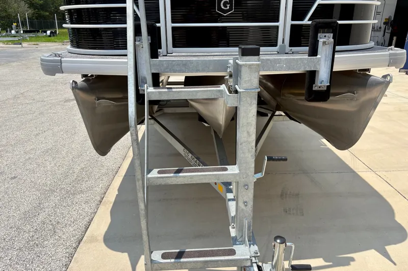 Slide: The Image of 2023 Sweetwater 2286 FSL pontoon boat on trailer, front view with ladder. - 15