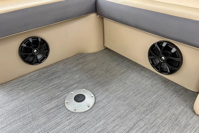 Slide: The Image of Interior of 2023 Sweetwater 2286 FSL boat with speakers and carpeted flooring. - 41