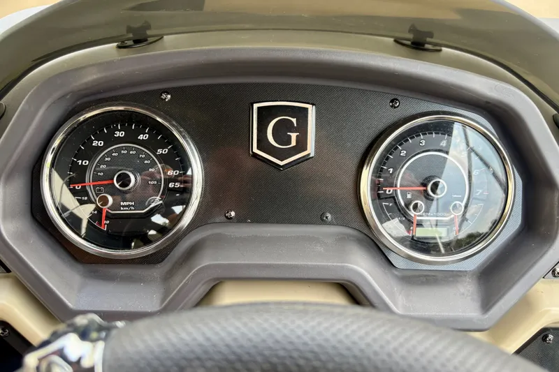 Slide: The Image of Dashboard of 2023 Sweetwater 2286 FSL boat with speedometer and tachometer gauges. - 33
