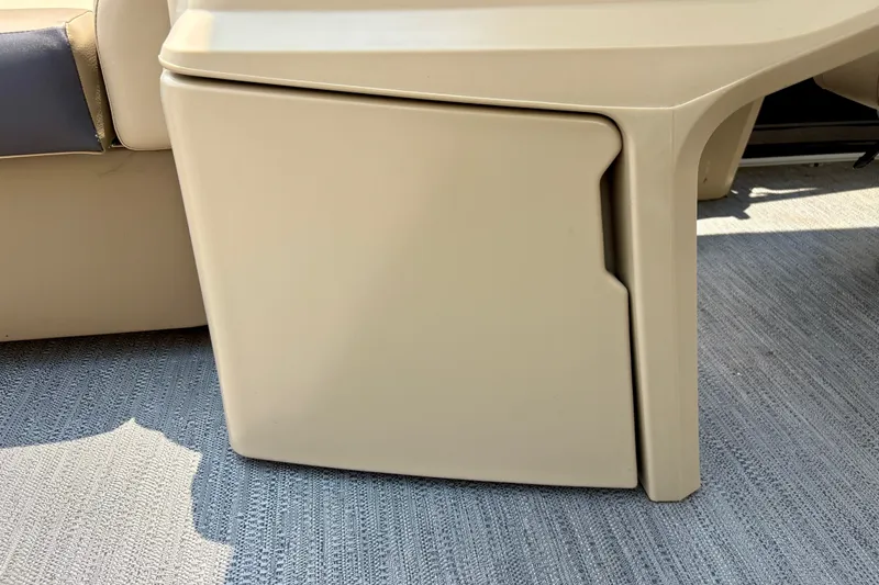 Slide: The Image of 2023 Sweetwater 2286 FSL boat interior storage compartment on textured flooring. - 45