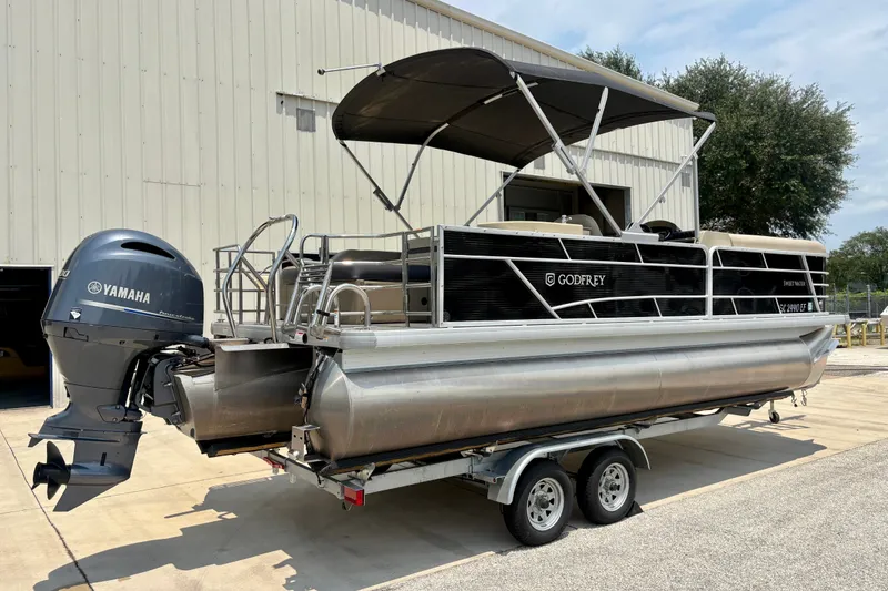 Slide: The Image of 2023 Sweetwater 2286 FSL pontoon boat with Yamaha motor on trailer. - 2