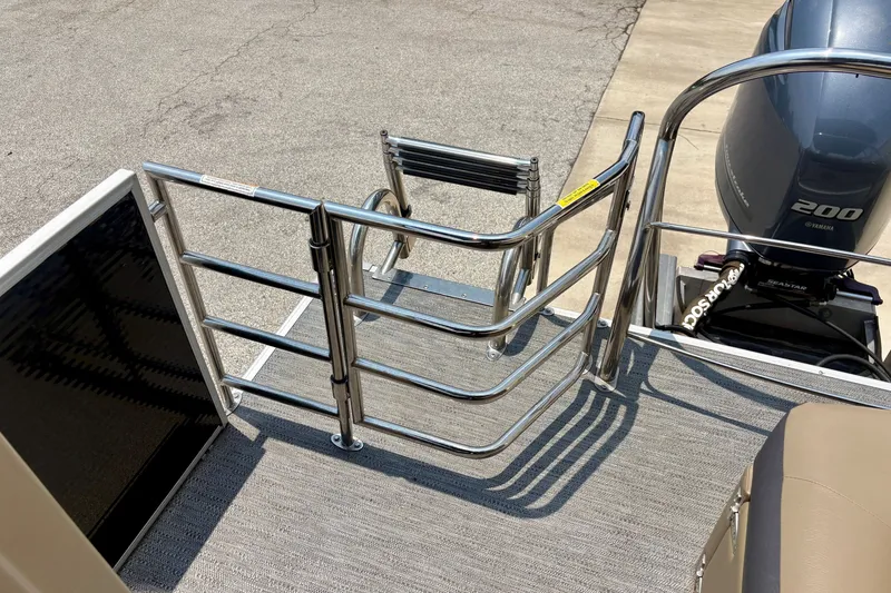 Slide: The Image of 2023 Sweetwater 2286 FSL boat with stainless steel railing and Yamaha 200 engine. - 20