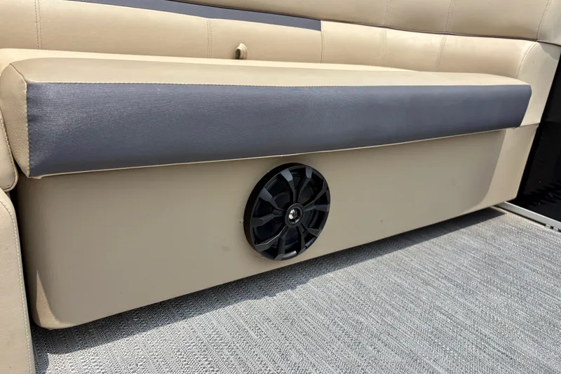 Slide: The Image of 2023 Sweetwater 2286 FSL boat seat with integrated speaker, beige and gray upholstery. - 43