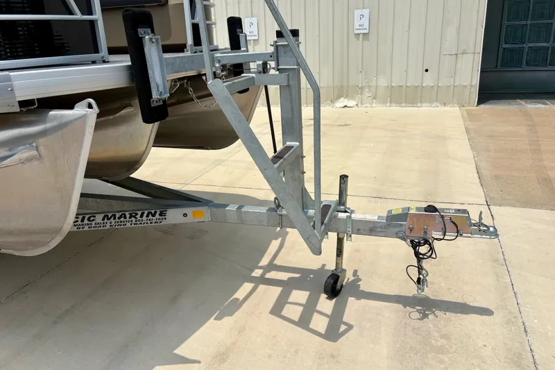 Slide: The Image of 2023 Sweetwater 2286 FSL boat trailer parked on concrete surface. - 47