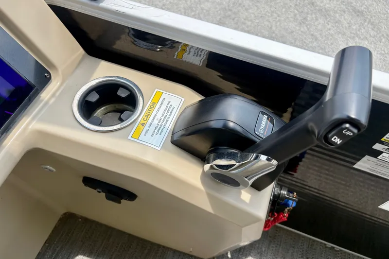 Slide: The Image of Control panel of 2023 Sweetwater 2286 FSL boat with throttle lever and caution label. - 35