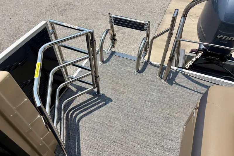 Slide: The Image of 2023 Sweetwater 2286 FSL boat deck with stainless steel railings and Yamaha motor. - 21