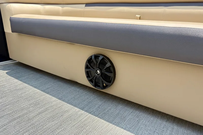Slide: The Image of Speaker installed on Sweetwater 2286 FSL boat seat, 2023 model, beige and gray upholstery. - 42