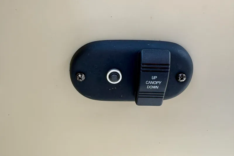 Slide: The Image of Switch for canopy control on 2023 Sweetwater 2286 FSL boat. - 44