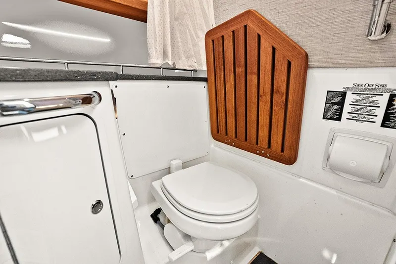 Slide: The Image of Head with solid teak flip up seat over toilet - 38