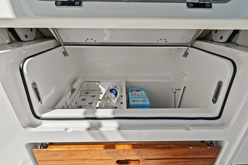 Slide: The Image of Insulated built-in cooler/storage under second row seating - 21