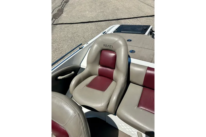 Slide: The Image of 2006 Ranger 180 Reata boat seat with beige and maroon upholstery. - 25
