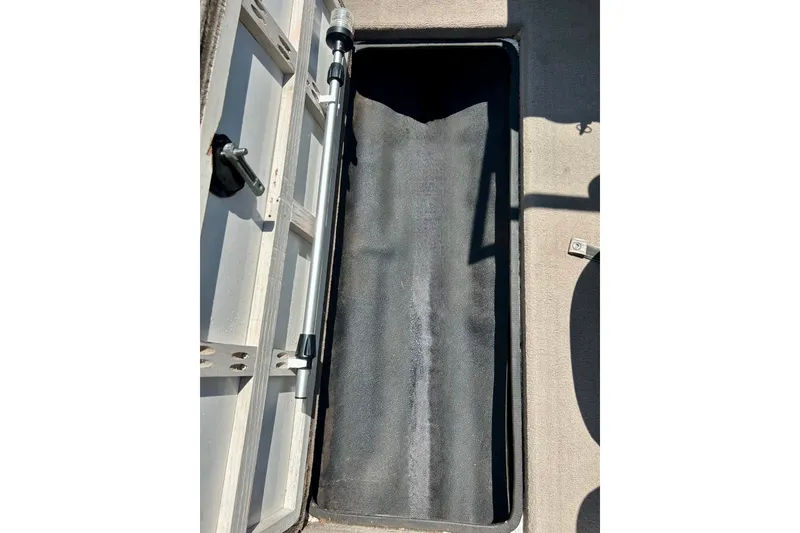 Slide: The Image of Open storage compartment on a 2006 Ranger 180 Reata boat, showing interior details. - 36