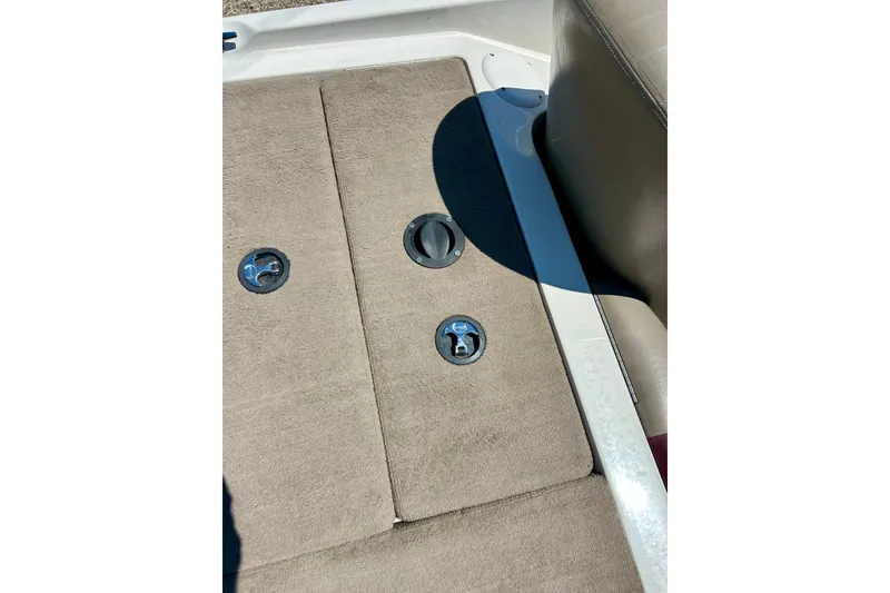 Slide: The Image of 2006 Ranger 180 Reata boat interior with beige carpet and seat detail. - 43