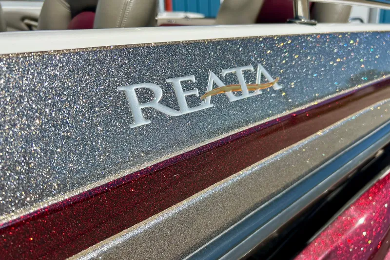 Slide: The Image of 2006 Ranger 180 Reata boat with sparkling silver and red exterior detailing. - 9
