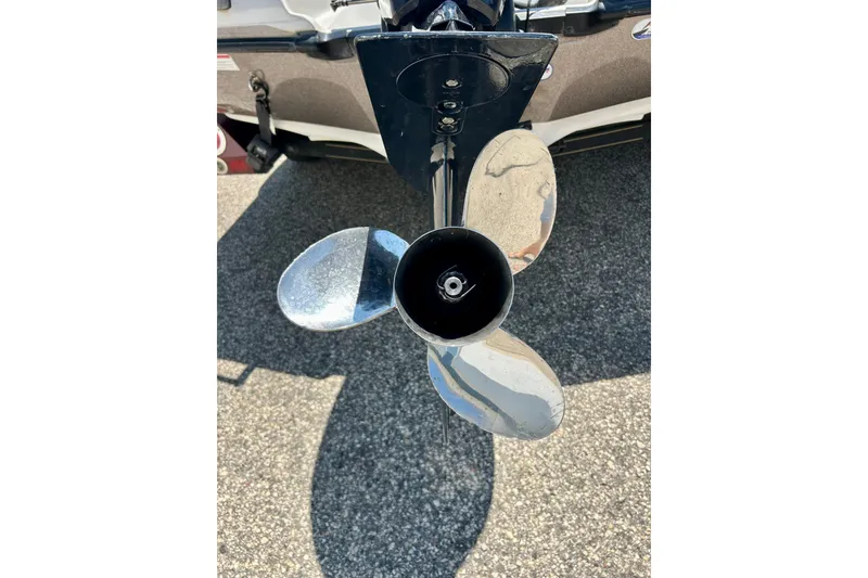 Slide: The Image of Propeller of 2006 Ranger 180 Reata boat on pavement background. - 15