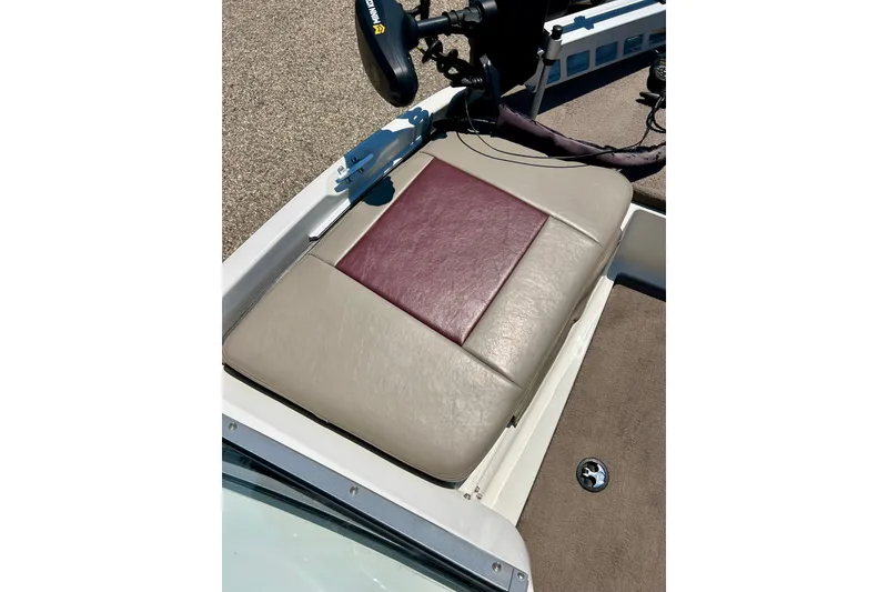 Slide: The Image of 2006 Ranger 180 Reata boat seat with beige and maroon upholstery. - 17