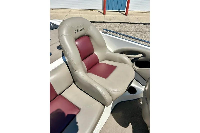Slide: The Image of 2006 Ranger 180 Reata boat seat with beige and maroon upholstery. - 26
