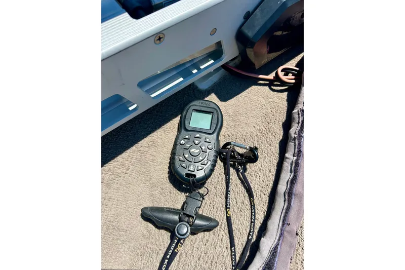 Slide: The Image of Remote control on a 2006 Ranger 180 Reata boat deck, featuring Minn Kota accessories. - 22