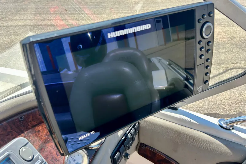 Slide: The Image of Humminbird Helix 10 fishfinder on 2006 Ranger 180 Reata boat dashboard. - 33