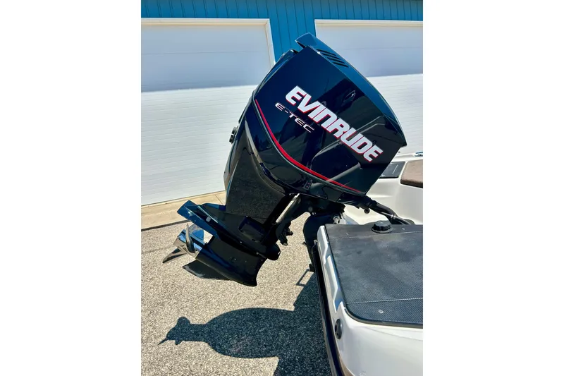 Slide: The Image of 2006 Ranger 180 Reata boat with Evinrude E-TEC outboard motor in sunlight. - 13