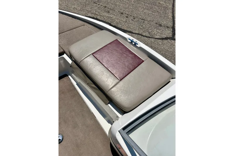 Slide: The Image of 2006 Ranger 180 Reata boat seat with beige and maroon upholstery detail. - 18
