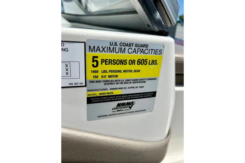 Slide: The Image of 2006 Ranger 180 Reata capacity label, 5 persons or 605 lbs, 150 HP motor. - 37