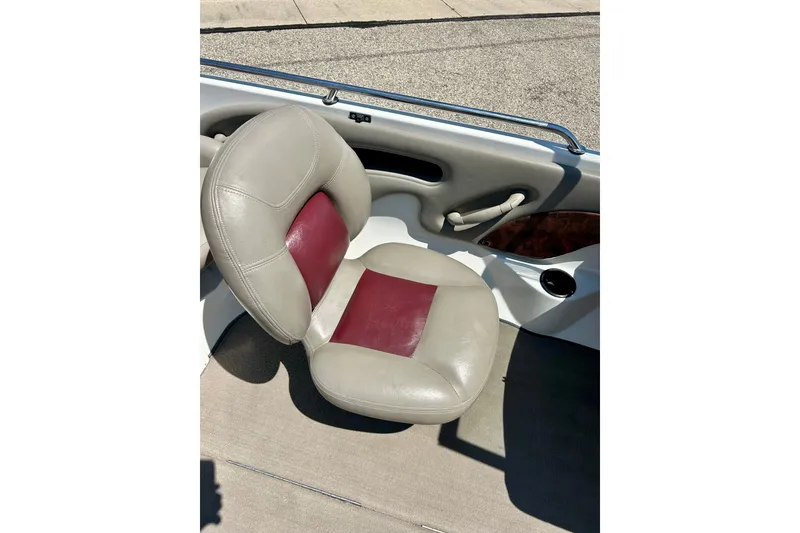 Slide: The Image of 2006 Ranger 180 Reata boat seat with beige and maroon upholstery. - 27