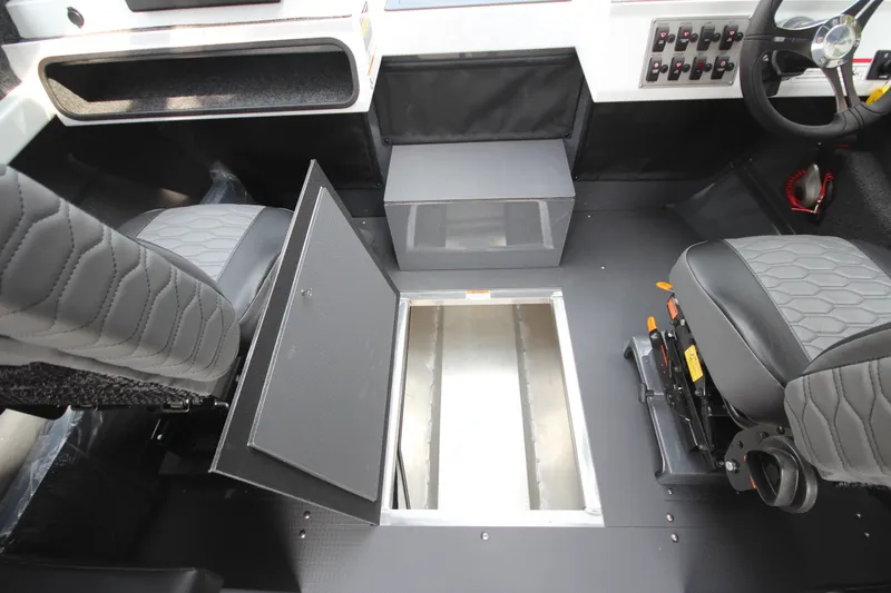 Slide: The Image of Interior of 2027 Weldcraft 240 Maverick DV boat with open storage compartment. - 27