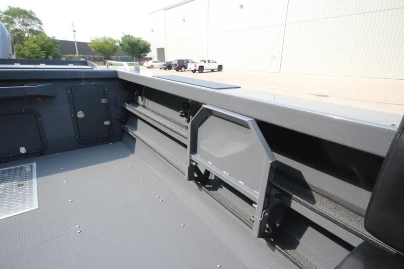 Slide: The Image of Interior view of 2027 Weldcraft 240 Maverick DV boat, showcasing storage compartments. - 16