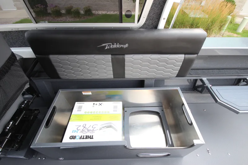 Slide: The Image of 2027 Weldcraft 240 Maverick DV interior storage compartment with sleek design and modern features. - 20