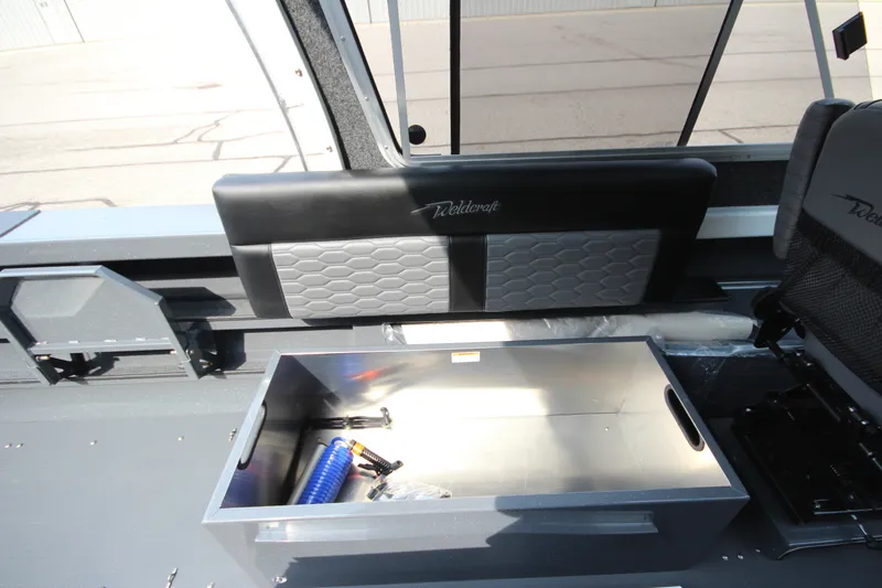 Slide: The Image of Interior of 2027 Weldcraft 240 Maverick DV boat with storage compartment open. - 18