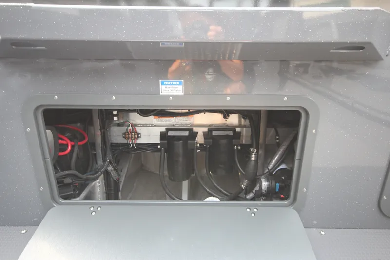 Slide: The Image of Engine compartment of 2027 Weldcraft 240 Maverick DV boat, showcasing wiring and components. - 13