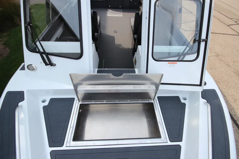 Slide: The Image of 2027 Weldcraft 240 Maverick DV boat interior with open storage compartment. - 30