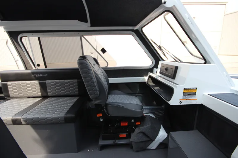 Slide: The Image of Interior of 2027 Weldcraft 240 Maverick DV boat with modern seating and dashboard. - 22