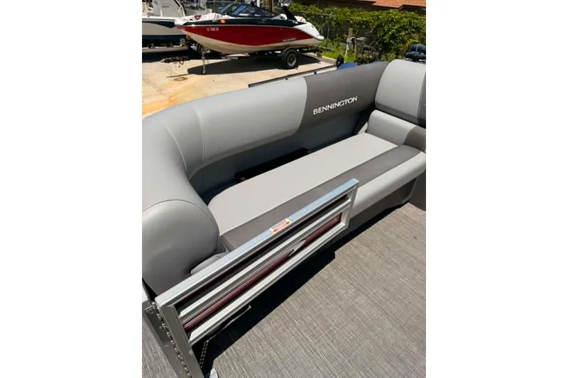 Slide: The Image of 2024 Bennington SV 20 boat interior with gray seating and branded upholstery. - 8